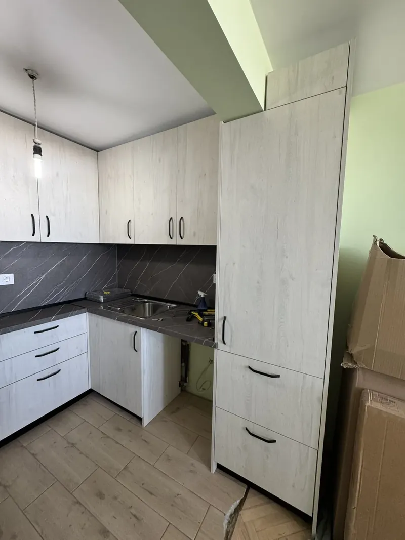 Kitchen tall units with integrated fridge housing