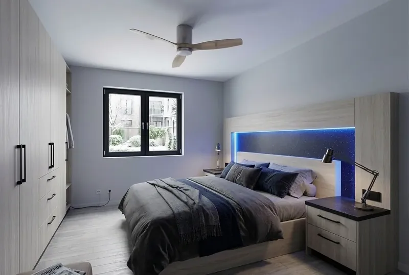 Design visualisation of a bedroom with a lit headboard wall and wardrobes
