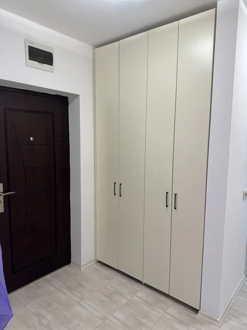 Cream hinged-door hallway wardrobe
